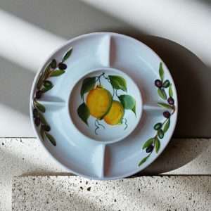 ceramic appetizer tray decorated with lemons and olives on a white background, suitable for all kinds of appetizers