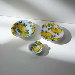 Bowl, Small Bowl, and Ceramic Plate with Lemon Design and leaves on a white background