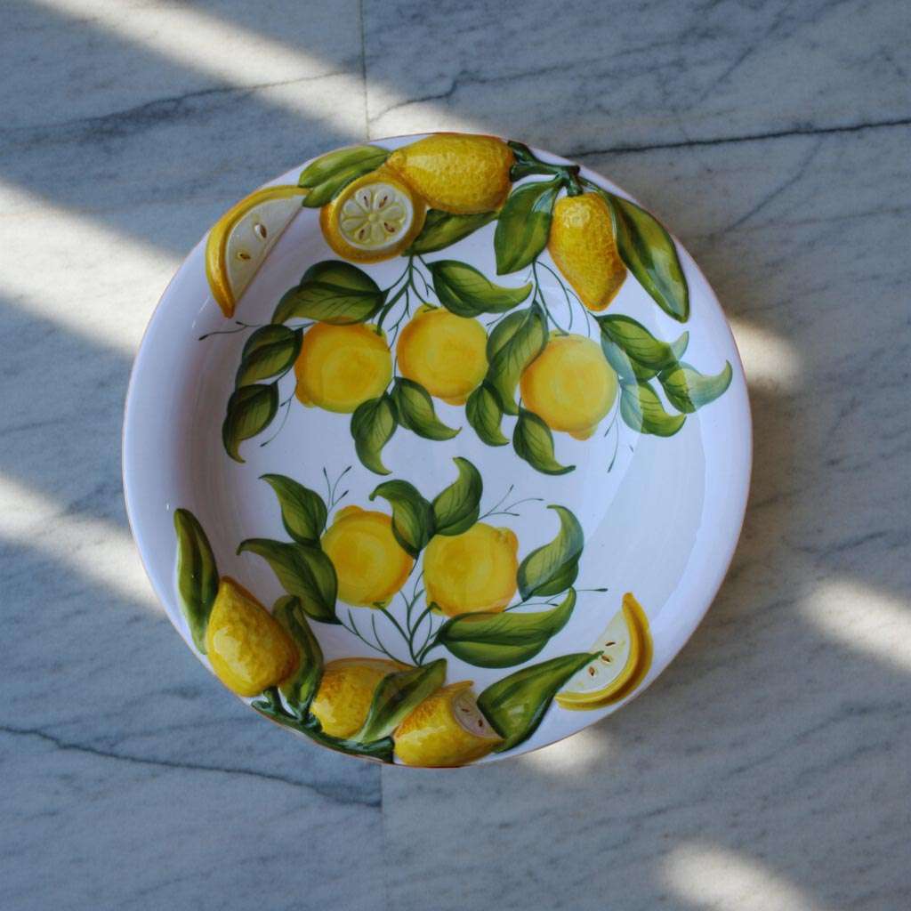 Details of Centerpiece with Raised Ceramic, Decorated with Lemon and Leaves on a White Background