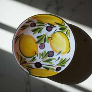 details of Ceramic Bowl with Lemon and Olive Design on a white background