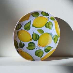 details of the Giada ceramic bowl decorated with lemons and leaves on a white background