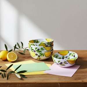 handmade ceramic containers with lemon and olive design on a white background
