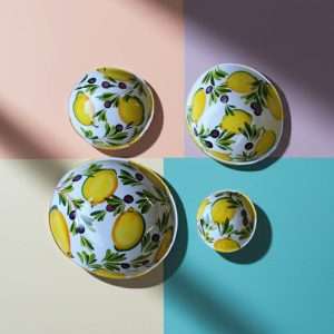 handmade ceramic containers with lemon and olive design on a white background