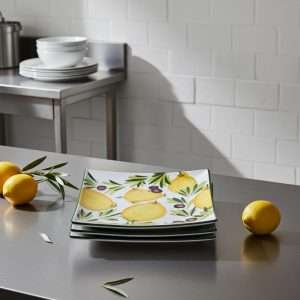 square high-quality ceramic plates decorated with lemons and olives on a white background