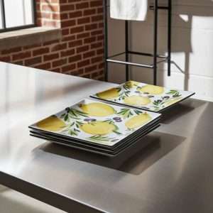 square high-quality ceramic plates decorated with lemons and olives on a white background