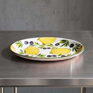 ceramic baking dish with lemon and olive design on a white background