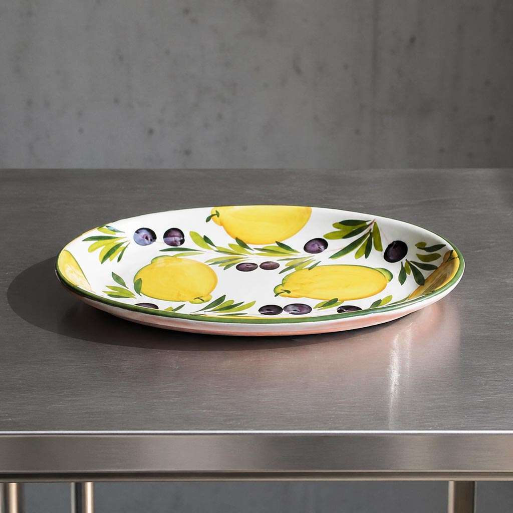 ceramic baking dish with lemon and olive design on a white background