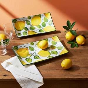details of a rectangular ceramic tray with lemon and leaf design on a white background