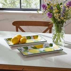 rectangular ceramic trays with lemon and leaf decor on a white background
