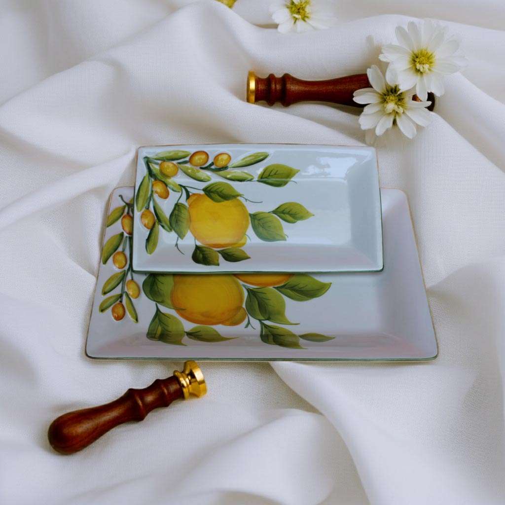 set of storage trays with lemon design on a white background