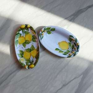 Details of Designer Trays with Lemon and Leaf Motif on a White Background