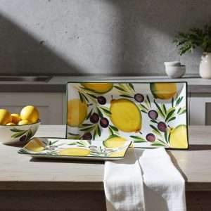 kitchen trays with lemon and olive decor on white background