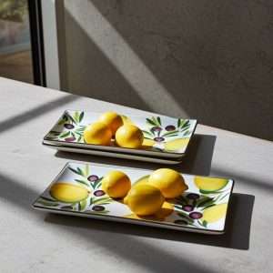 kitchen trays with lemon and olive decor on white background