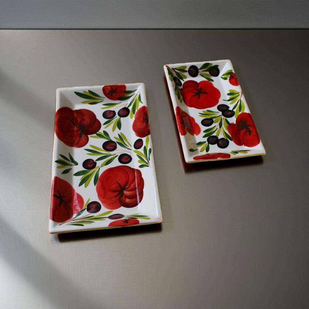 Details of Rectangular Trays with Tomato and Olive Design on a White Background