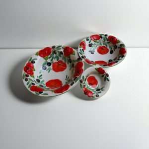 hand-painted ceramic with tomato and olive design on a white background