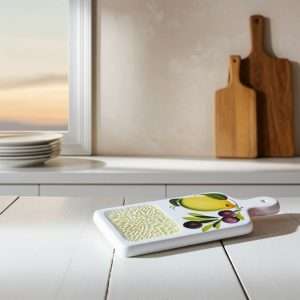 White Ceramic Garlic Grater with Various Designs on a White Background