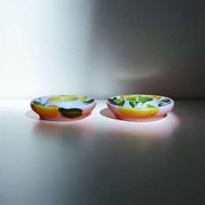 ceramic egg holder with lemon and olive design on a white background