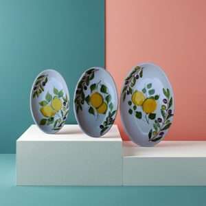 Serving tray set with lemon and olive decor on a white background