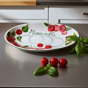 Italian handcrafted white tray decorated with tomato and mozzarella design on a white background